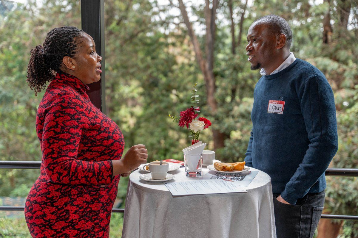 Two delegates in conversation over coffee at the Event Speak Summit 2026