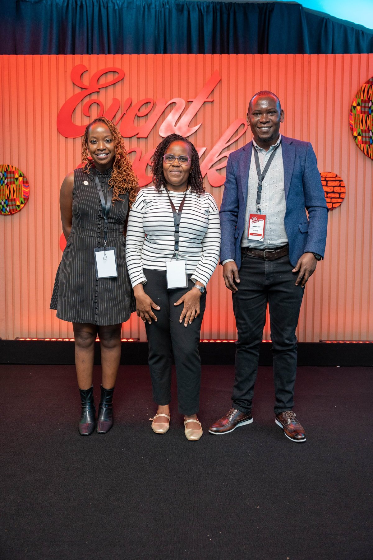 Speakers against the backdrop at the Event Speak Summit 2025
